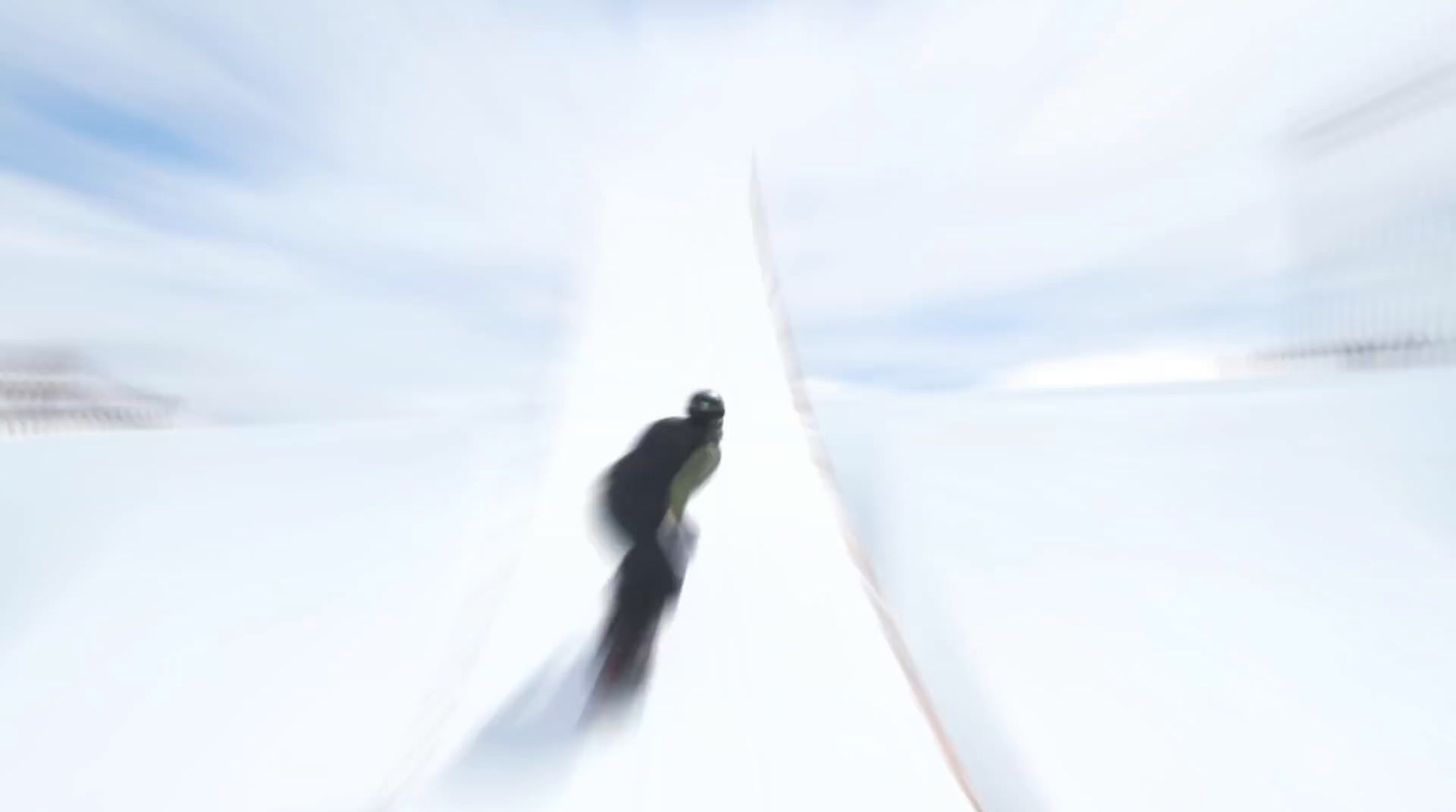 a blurry photo of a person skiing down a hill