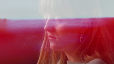 a woman sitting on a bus looking out the window