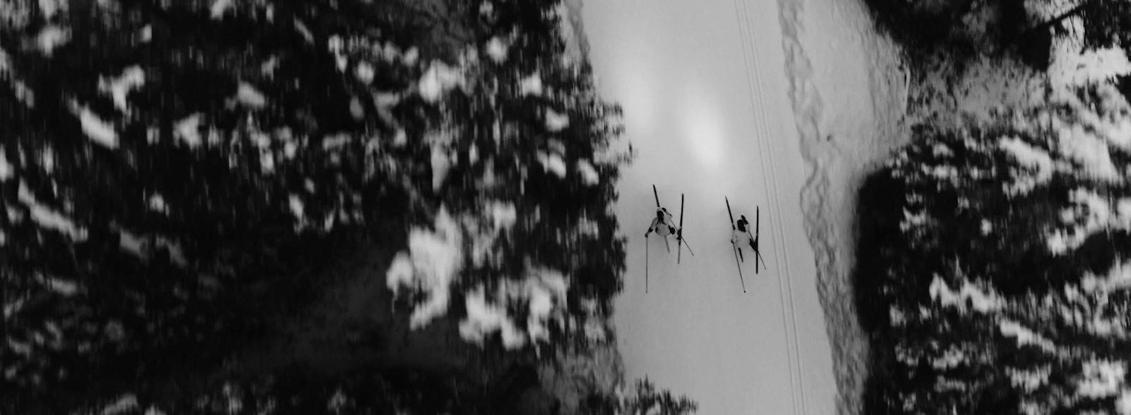 a black and white photo of a ski slope