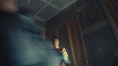 a blurry photo of a person standing in a room