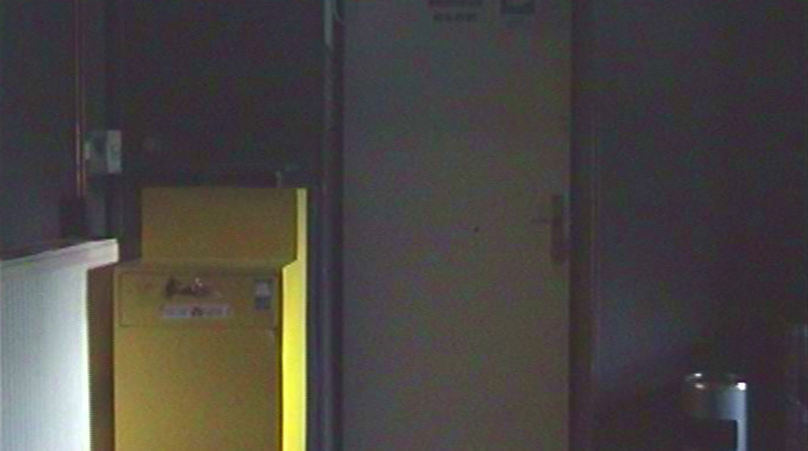 a yellow refrigerator freezer sitting inside of a kitchen