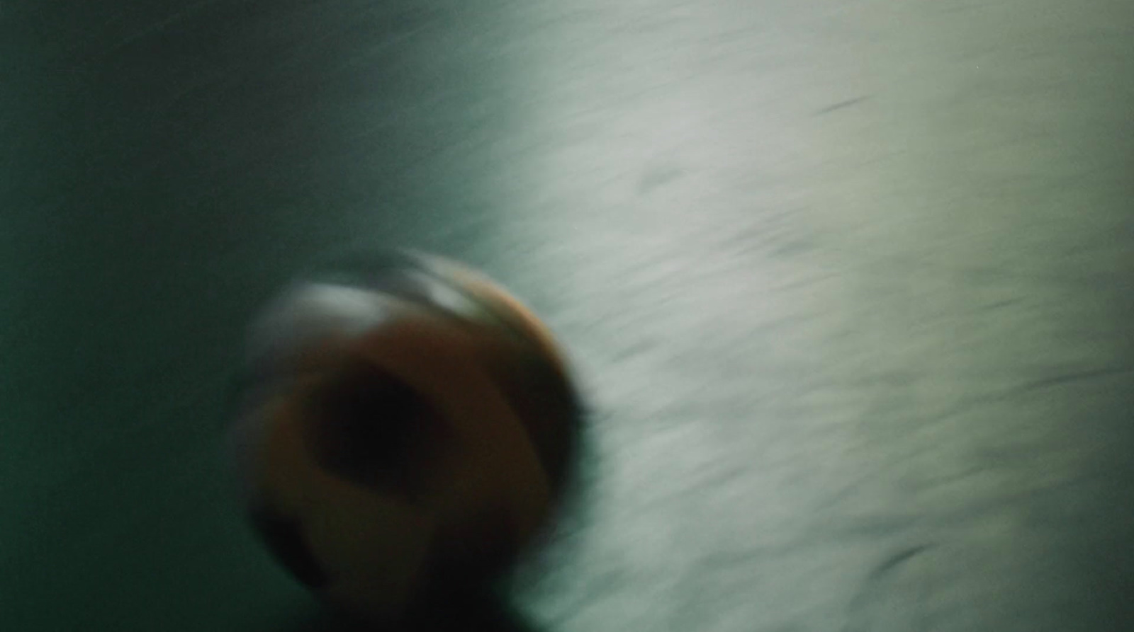 a blurry photo of a ball on the ground