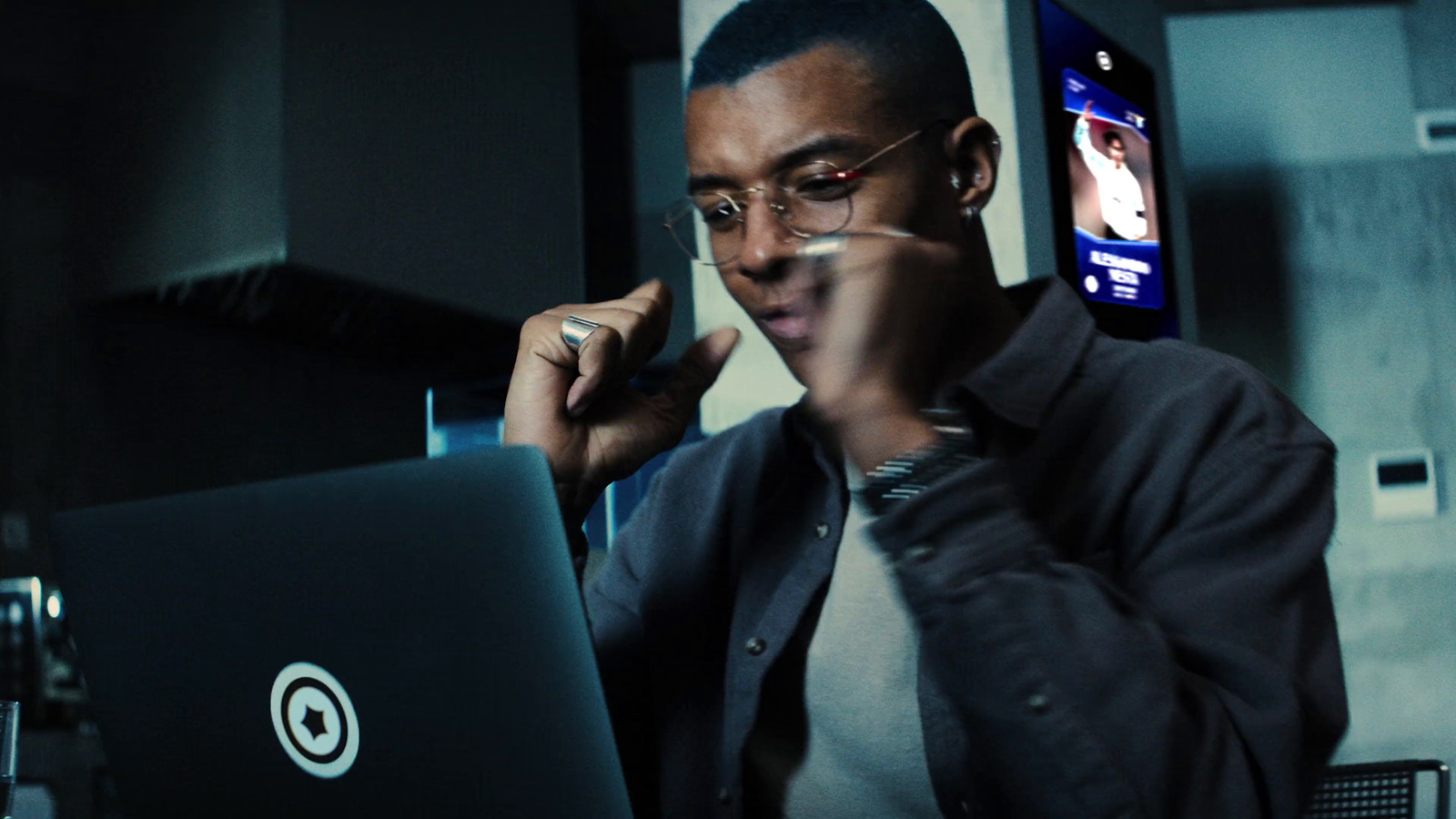 a man sitting in front of a laptop computer