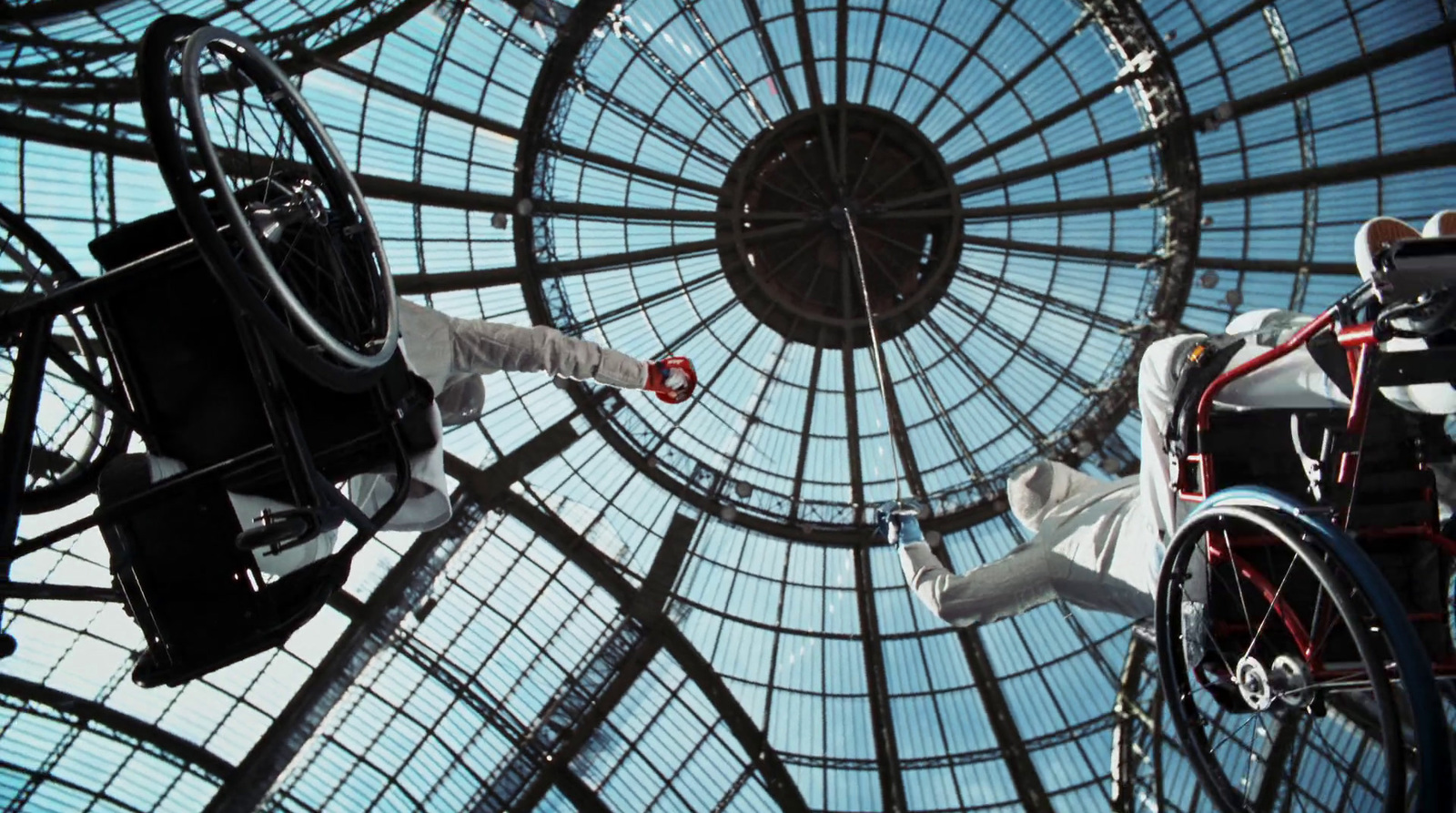 a man in a wheel chair in a glass dome