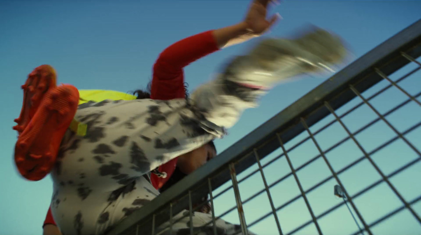 a man riding a skateboard down a metal hand rail