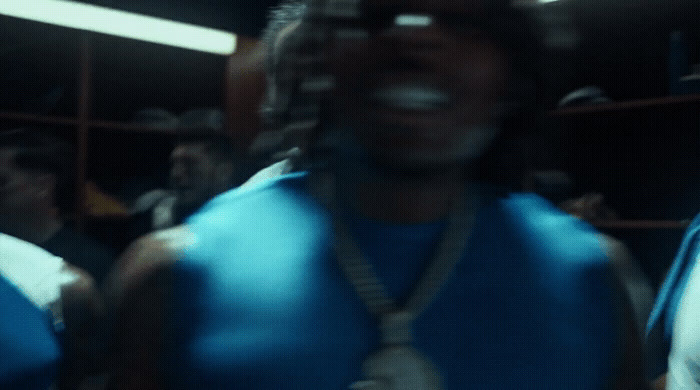 a blurry photo of a man wearing a blue shirt