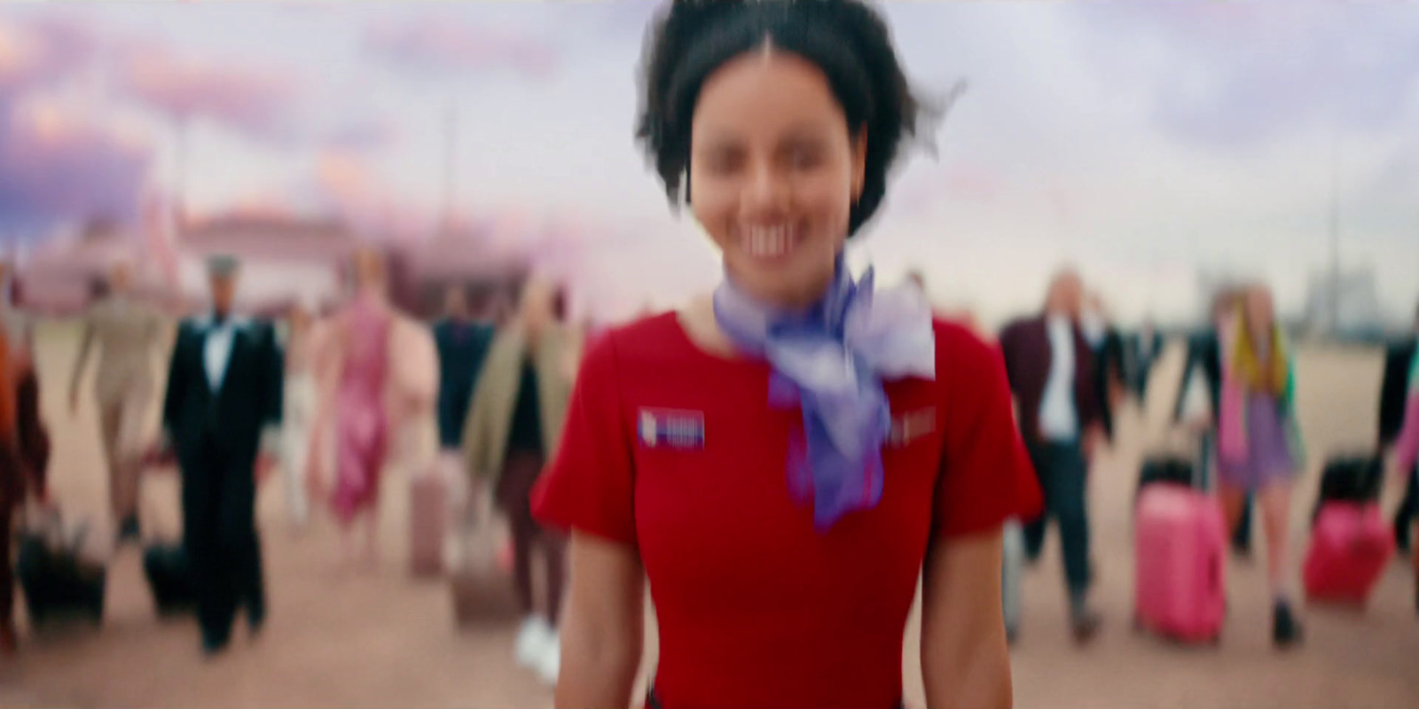 a blurry photo of a woman in a red shirt