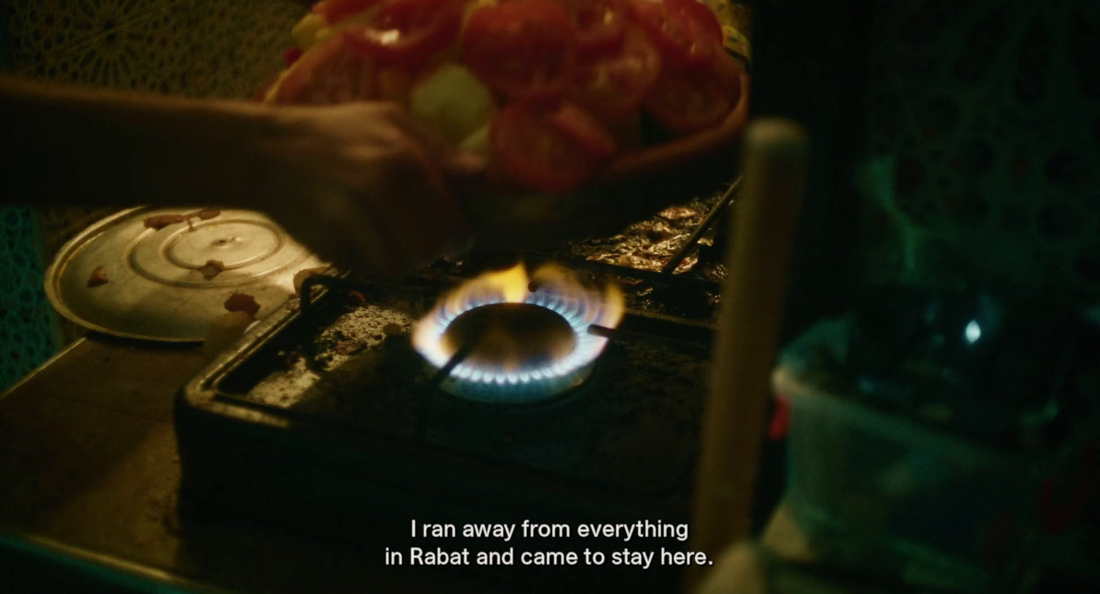 a person is cooking food on a stove