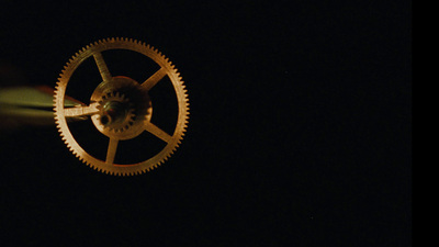 a close up of a clock in the dark