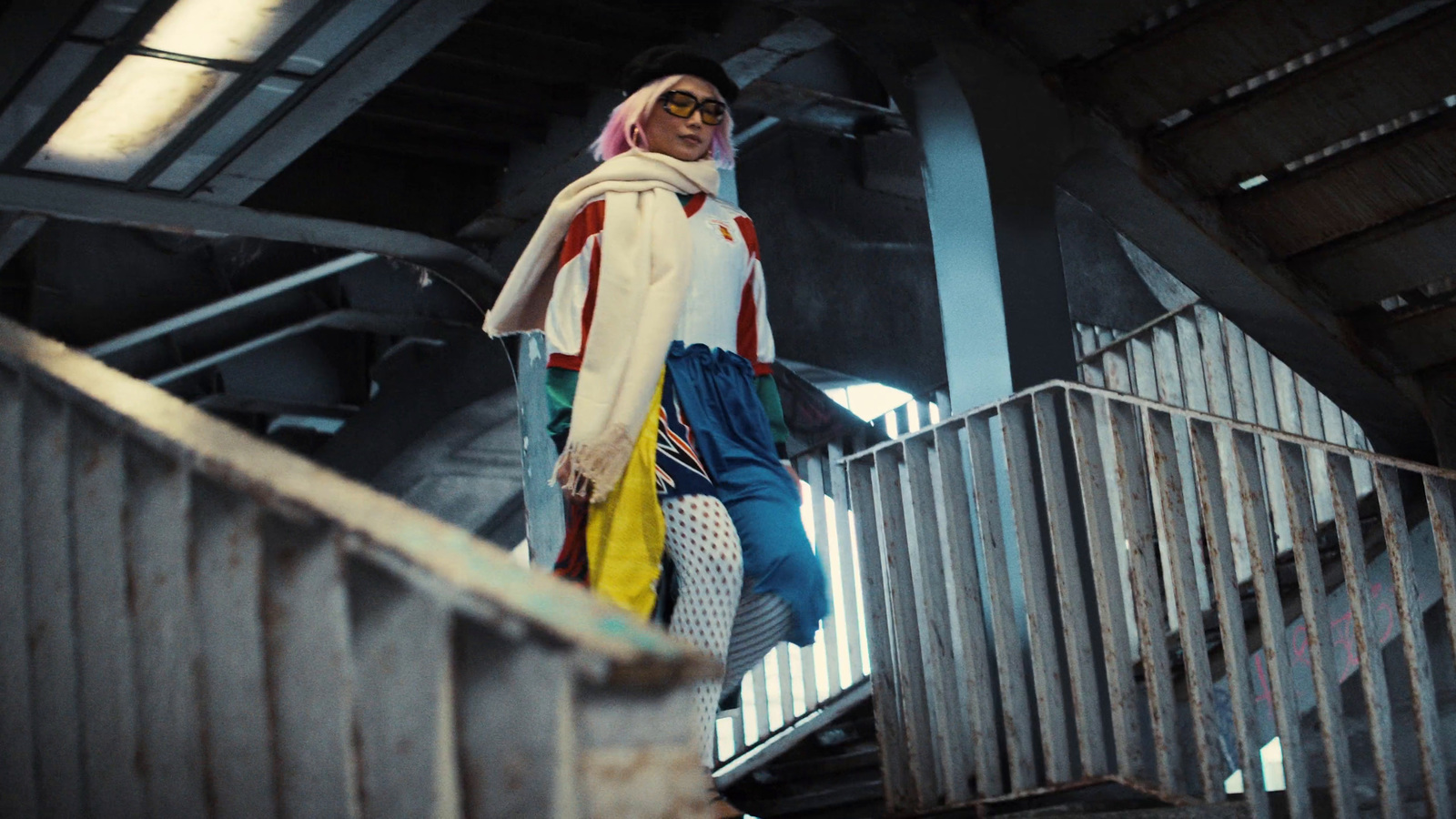 a woman walking down a flight of stairs