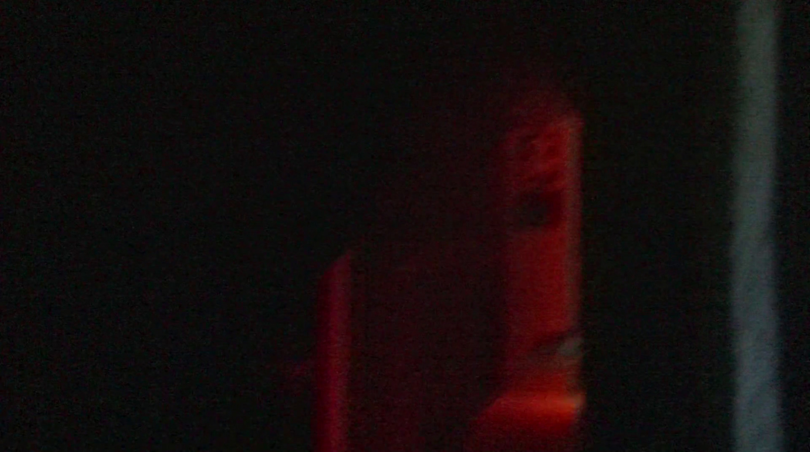 a blurry photo of a red light in the dark