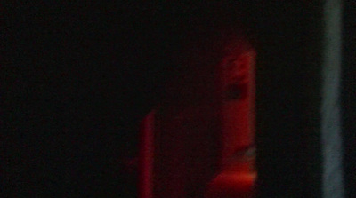 a blurry photo of a red light in the dark