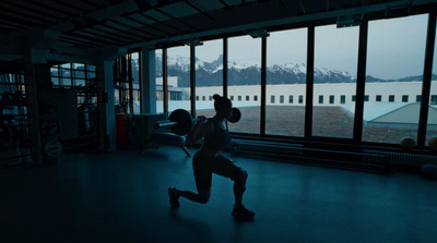 a person is running in a dark room