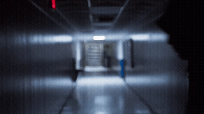 a blurry photo of a hallway in a building