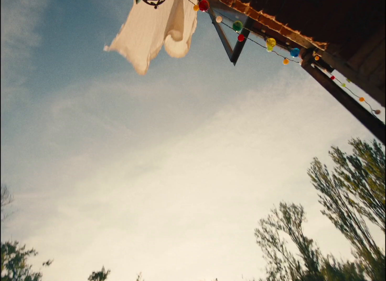 an umbrella is hanging upside down on a pole