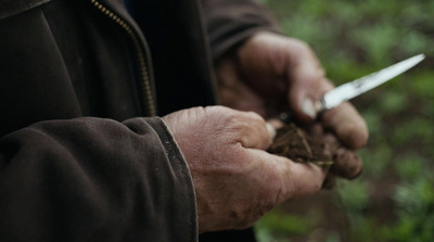 a man holding a pair of scissors in his hands