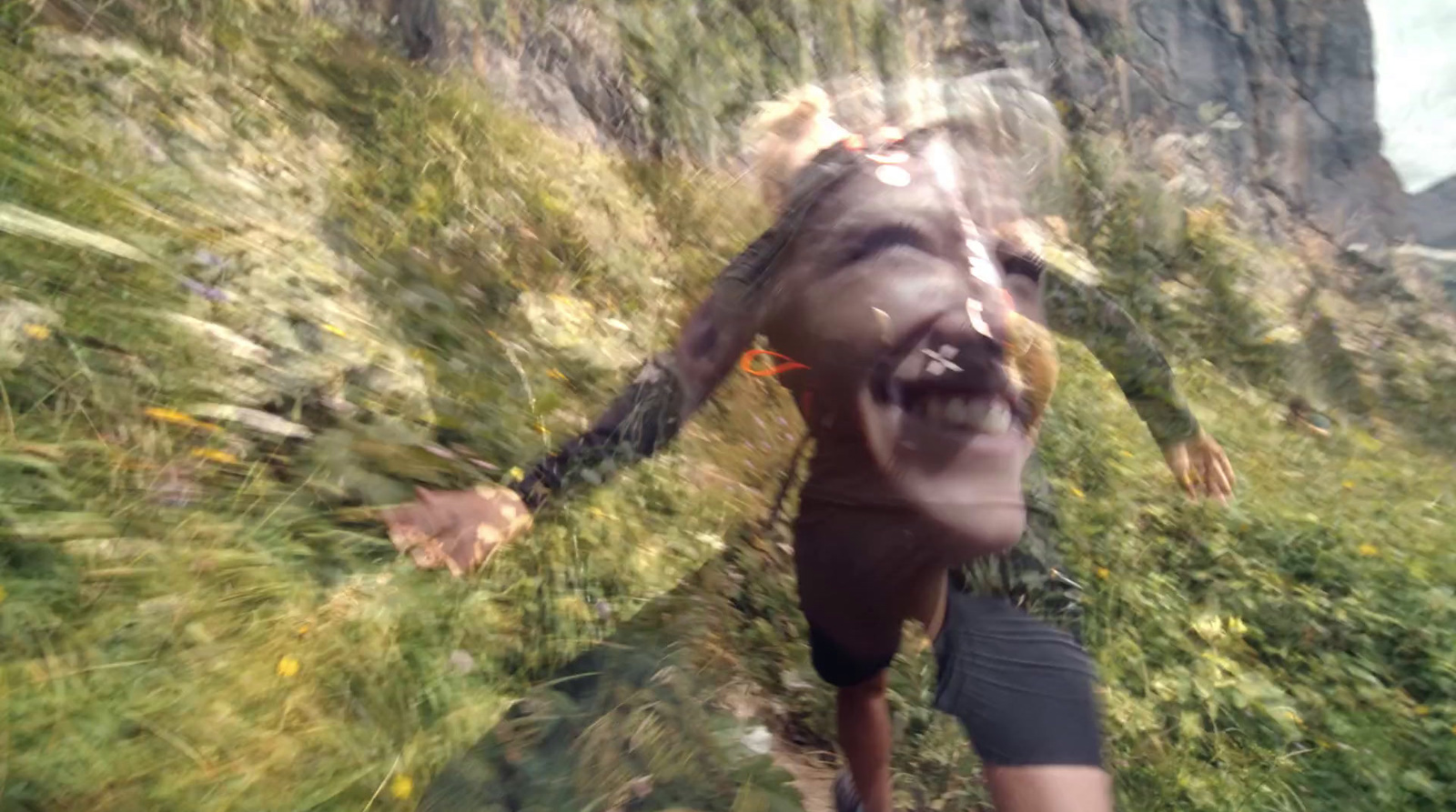 a blurry image of a man running up a hill