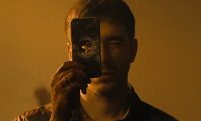 a man taking a picture of himself in a mirror