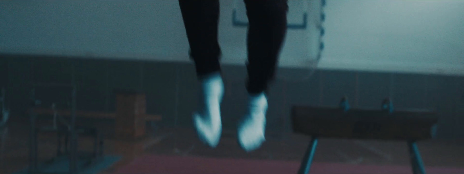 a person jumping in the air on a pair of shoes