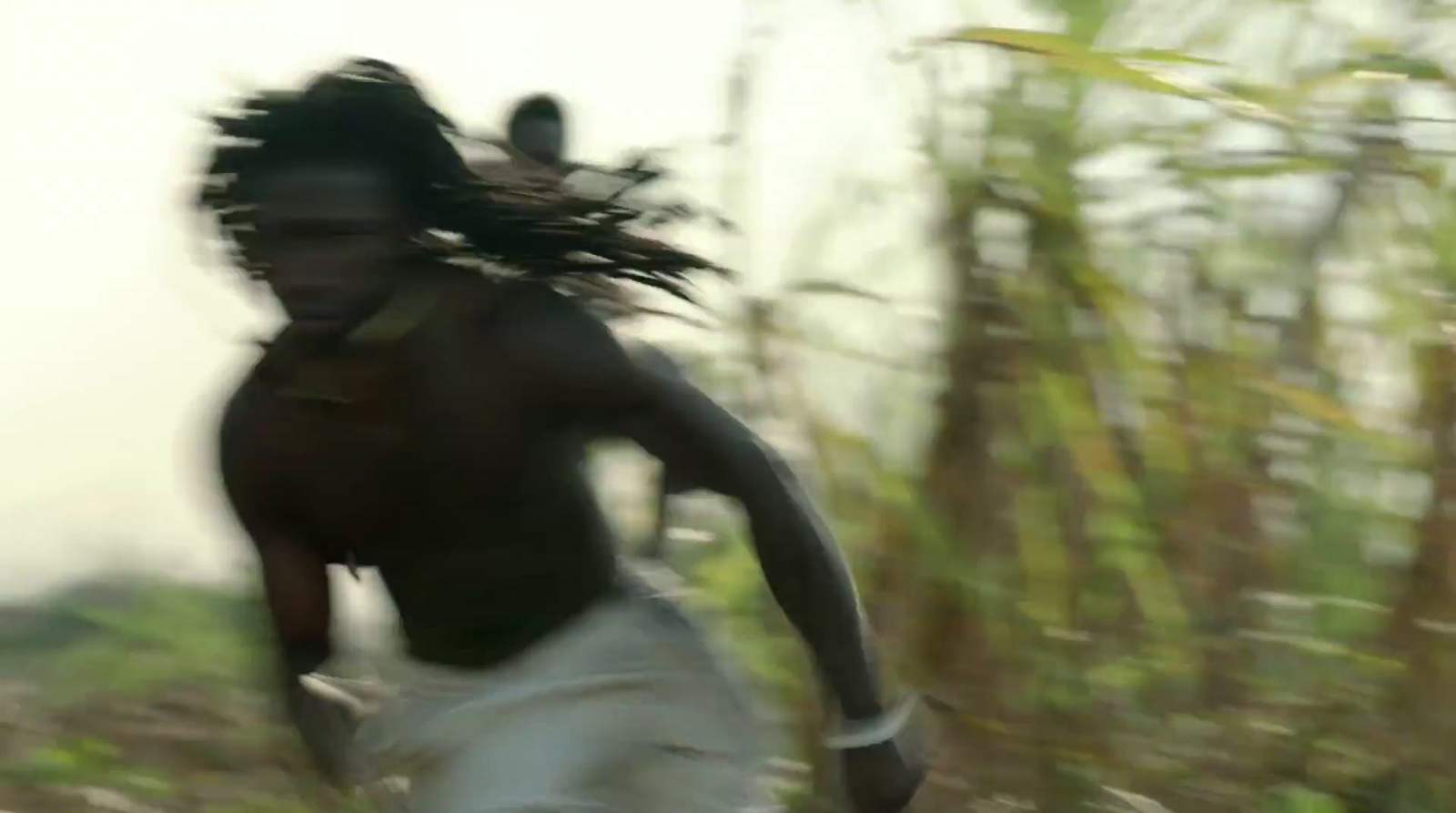 a blurry photo of a man running through a field