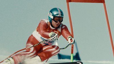 a person on skis going down a hill