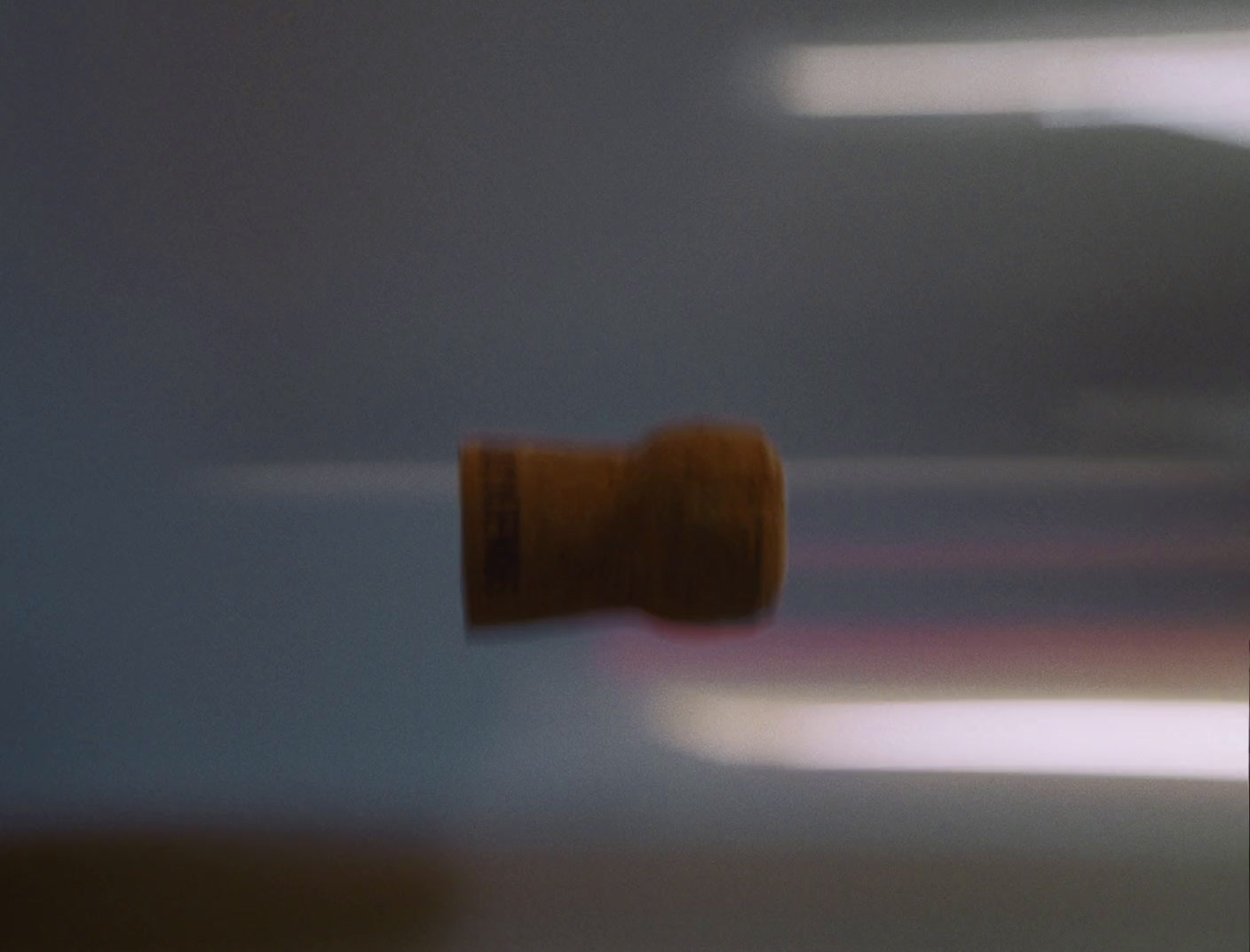 a blurry photo of a wine cork