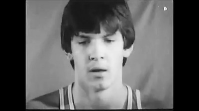 a black and white photo of a young man