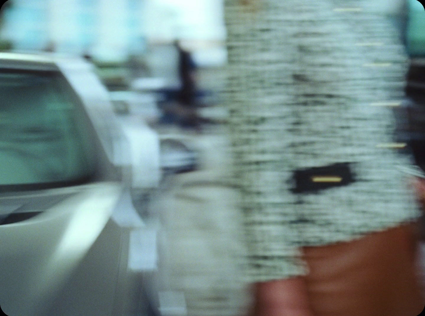 a blurry photo of a car and a tree