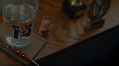 a glass of water sitting on top of a wooden table