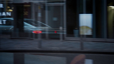 a reflection of a car in a window