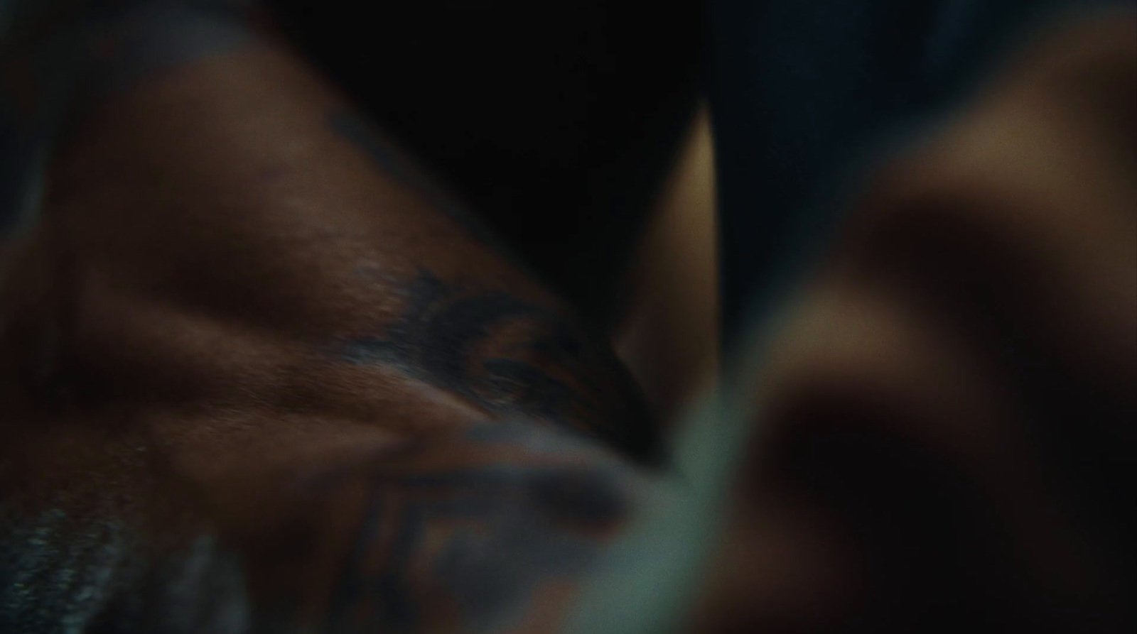 a close up of a person's arm with a tattoo on it