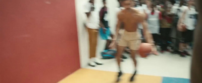 a blurry photo of a man holding a basketball