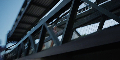 a man riding a skateboard down a metal ramp