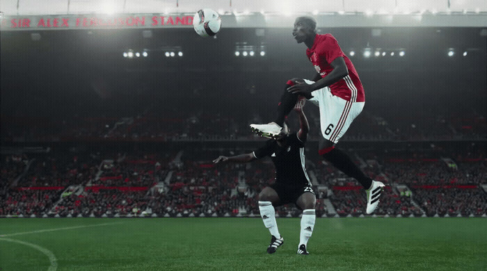 a couple of men playing a game of soccer