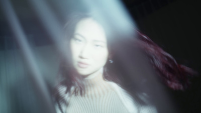 a blurry photo of a woman with long hair