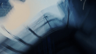 a blurry photo of a person with a cell phone