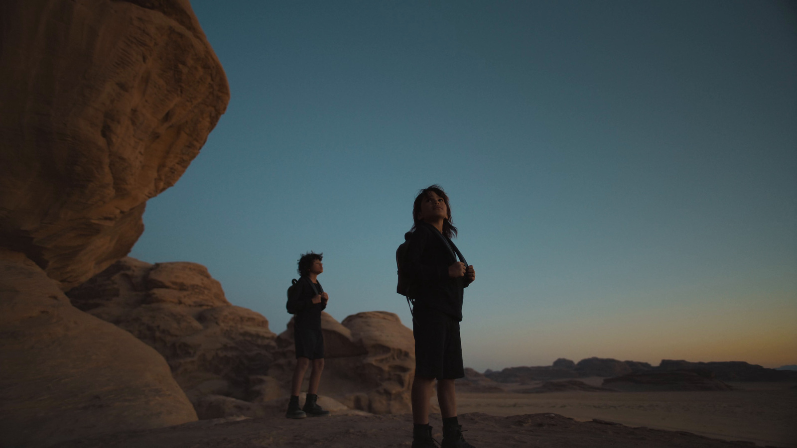 a couple of people that are standing in the dirt