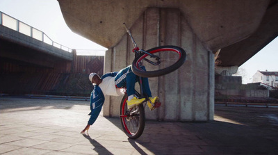 a man is doing a trick on a bike