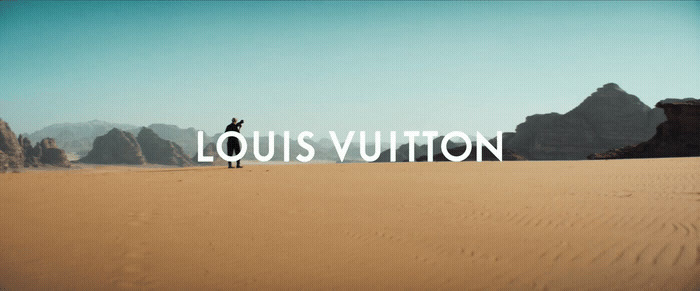 a person standing in the middle of a desert