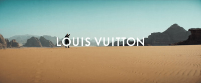 a person standing in the middle of a desert