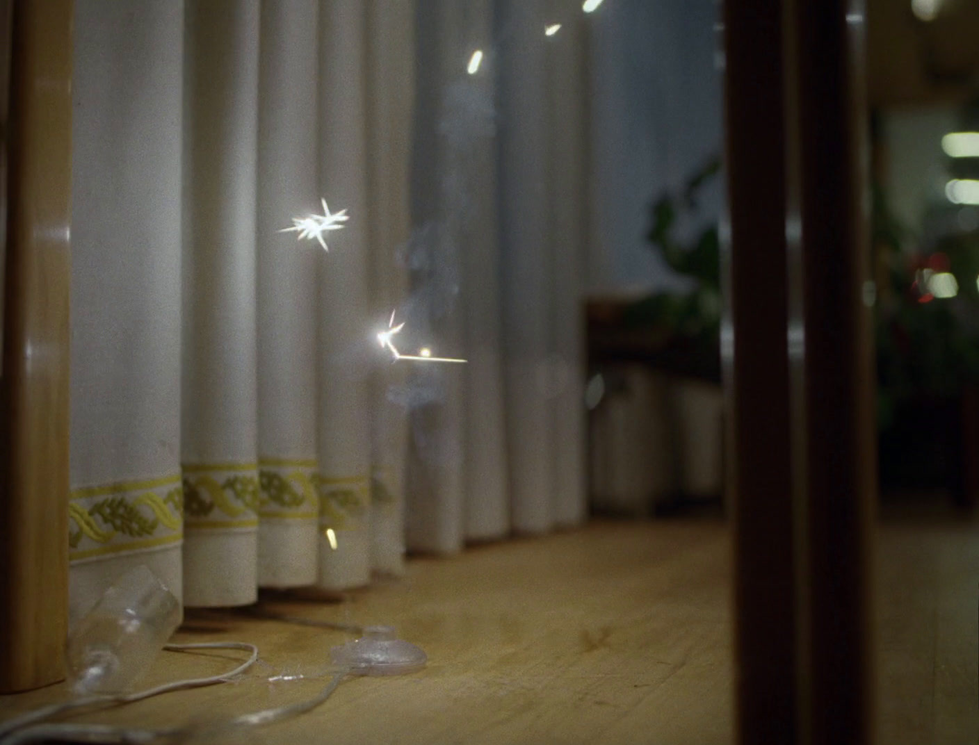 a room with curtains and a string of lights