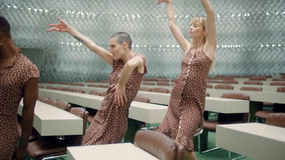 a couple of women standing next to each other in a room