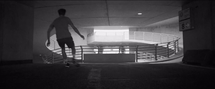 a man riding a skateboard down a flight of stairs