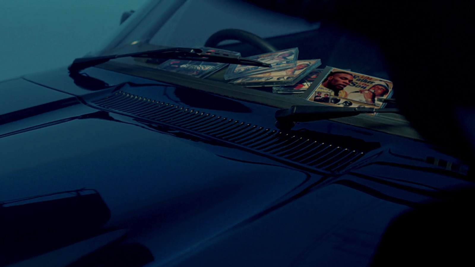 a close up of a car's hood with a picture of a man on