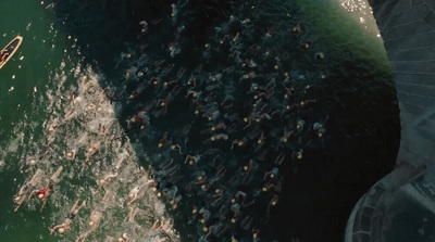 a large group of people in a body of water