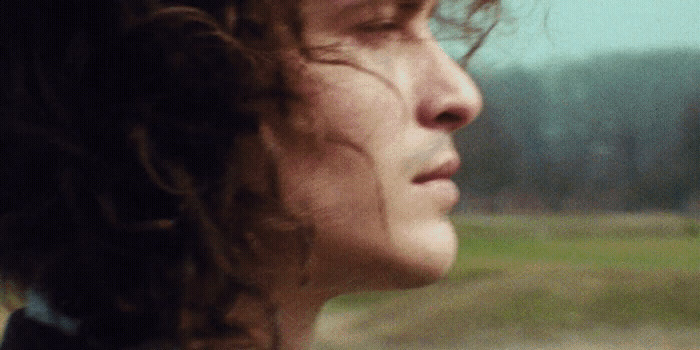 a close up of a person with long hair