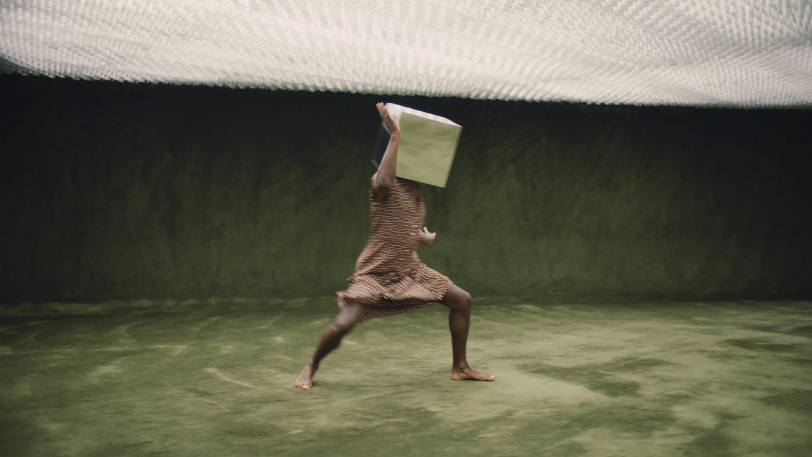 a person jumping in the air with a book on their head