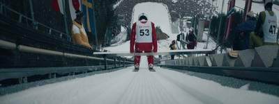 a person on skis standing in the snow