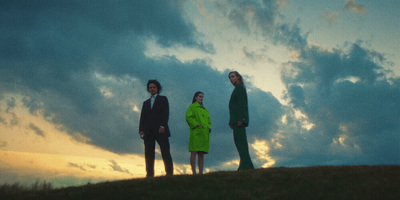 a group of people standing on top of a hill