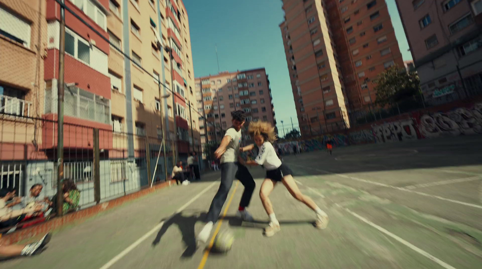 a couple of people that are standing in the street